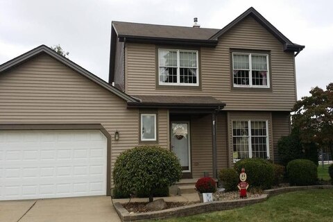 Отделка сайдингом коттеджа фото